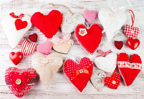 Valentine handmade hearts on the shabby wooden table