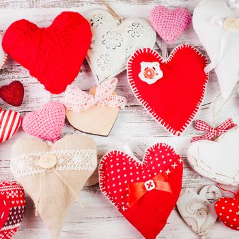 Valentine handmade hearts on the shabby wooden table