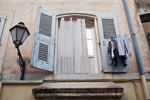Window of old house in Saint Tropez town, Provence, South France