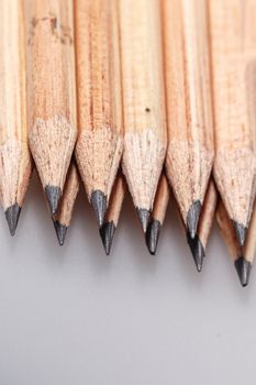 Graphite wooden pencils for sketching shot closeup background