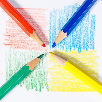 Brightly colored wooden pencils closeup shot background