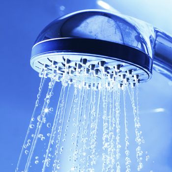 Water jet fresh shower in blue light