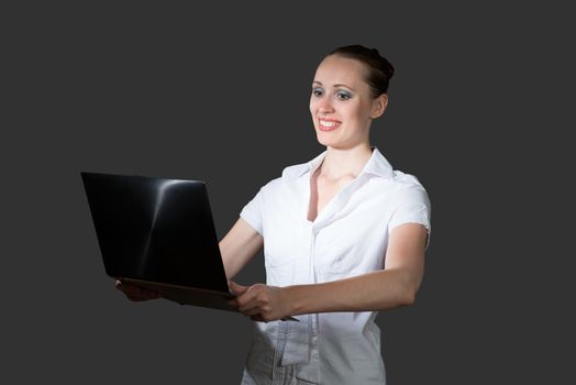 image of young business woman holding laptop