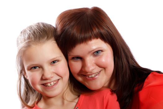 Mother and daughter smiling on a white background
