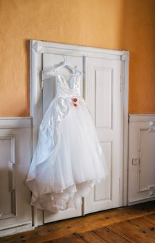 Wedding dress on hanger before a wedding