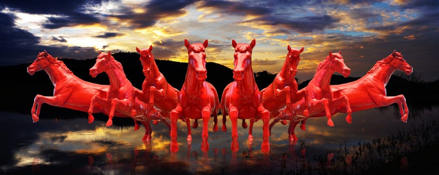 Group of red horses running with sunset sky background