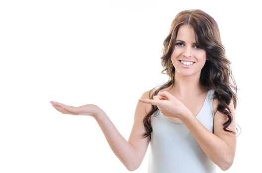 portrait of young beautiful brunette woman posing with empty hand palm up and showing it, holding imaginary object