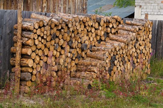 Stacked of firewood laying in the yard