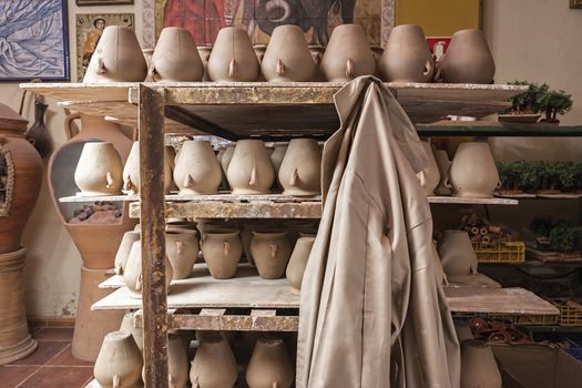 Transport car with salvers of ceramics ready to put them in the stove, clay pottery ceramics typical of Bailen, Jaen province, Andalucia, Spain