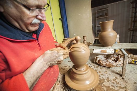 Potter making a jug of mud, clay pottery ceramics typical of Bailen, Jaen province, Andalucia, Spain