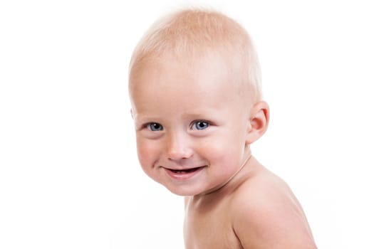 Portrait of a smiling nine-month old boy over white background