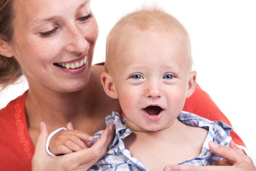 Cropped view of young Caucasian woman and her baby son over white