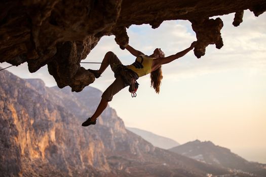 Rock climber at sunset, Kalymnos Island, Greece