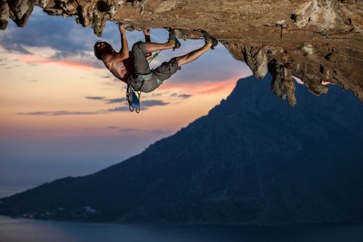 Rock climber at sunset, Kalymnos Island, Greece