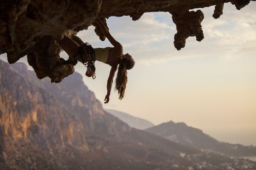 Rock climber at sunset, Kalymnos Island, Greece