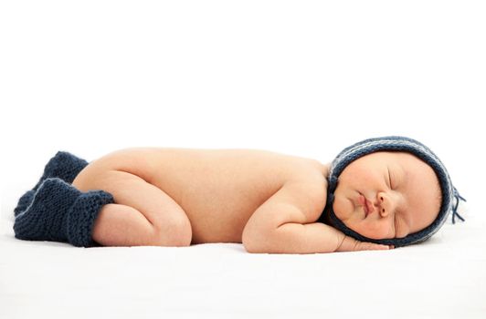 Newborn baby boy asleep over white background