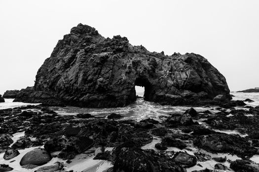 California Pfeiffer Beach in Big Sur State Park dramatic black and white rocks and waves