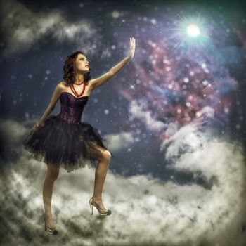 Young woman reaching for a glowing star, around abstract background