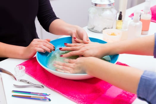 Nail saloon scrub bath exfoliant hands skin renewal in bowl water