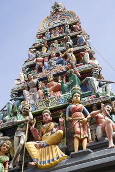 highly decorated entrance gate fragment of Sri Mariamman Temple located in Chinatown. This temple is oldest and most famous Hindu temple in Singapore.