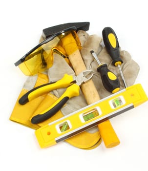 Close up of bunch of hand tools on a white background 
