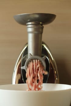 Meat grinder close up, preparation of forcemeat 