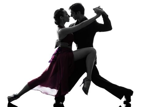 one caucasian couple man woman ballroom dancers tangoing in silhouette studio isolated on white background