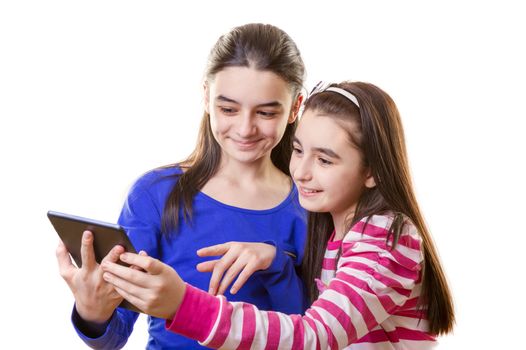 Happy teen girls with digital tablet  on white background
