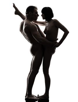 one caucasian couple man woman sexual kamasutra posture love activity in silhouette studio on white background