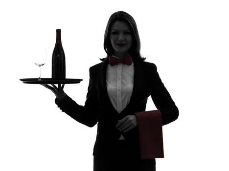 one caucasian woman waiter butler serving red wine in silhouette on white background