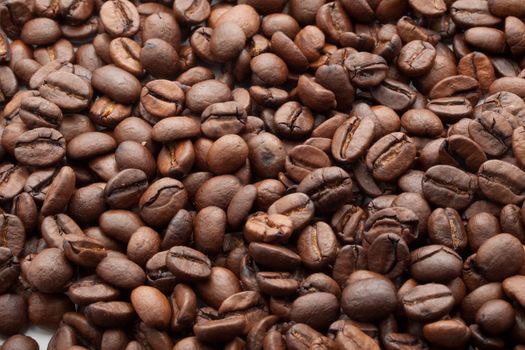 Close-up of brown coffee beans, background texture