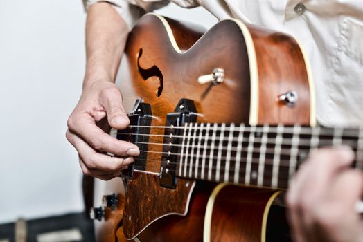 close-up on the fingers of the guitarist