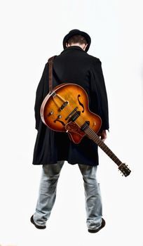  a guitarist with his guitar in the back isolated on white background