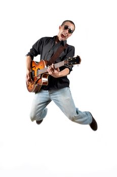 a guitarist jumps with his guitar isolated on white background