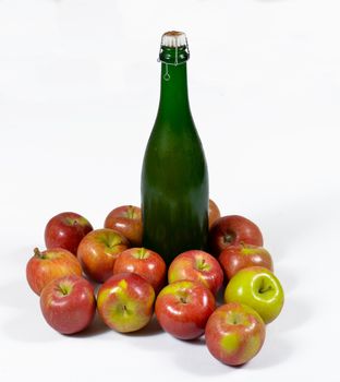 apples with a bottle of Norman cider, isolated on a white background
