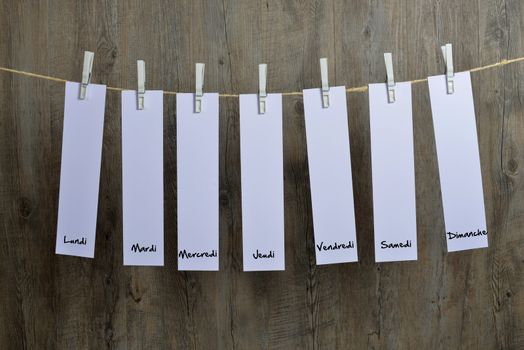 seven sheets of paper hanging on a clothesline