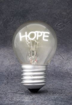 Bulb lighting up the word hope