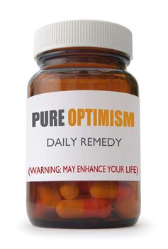 Container of 'optimism' pills over a white background 