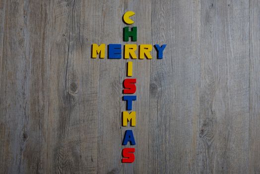 merry christmas written with small letters painted wood
