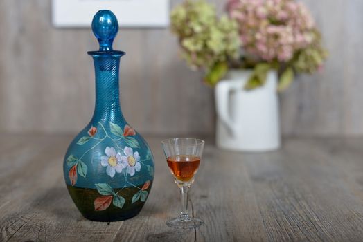 Former decanter with  small glasse with liqueur