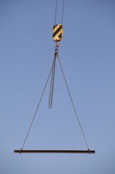 Steel beam swinging from a crane