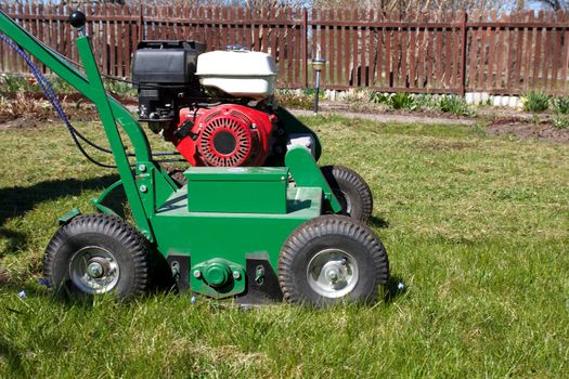 Lawn Aerator.A lawn aerator is a garden tool or machine designed to aerate the soil in which lawn grasses grow
