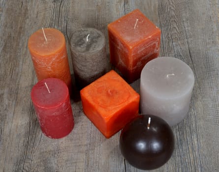 Several ornamental candles of different colors
