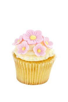 Isolated cupcake with pink floral decoarations. Clipping path included.