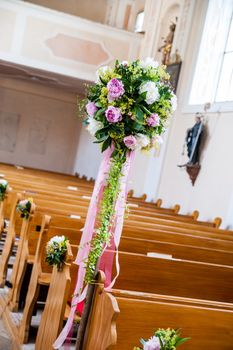 Wedding decoration with flowers in a Church