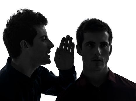 two caucasian young men gossip schyzophrenia concept in shadow white background