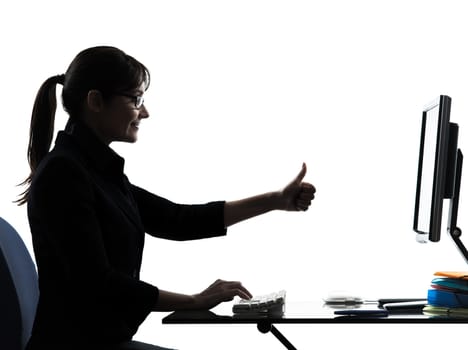 one business woman computer computing thumb up satisfied  silhouette studio isolated on white background