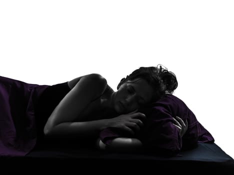 one woman in bed sleeping alarm clock silhouette studio on white background