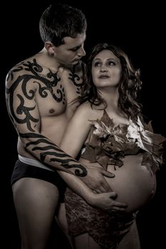 Pregnant couple, Maternity concept, Pregnant Woman holding her hands on her baby bump. Baby Shower