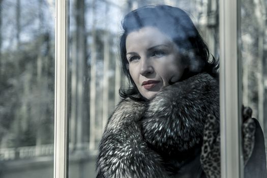 Beautiful woman in winter.Beauty Fashion Model Girl in a Fur Hat. Russian Stylish young.Portrait.
